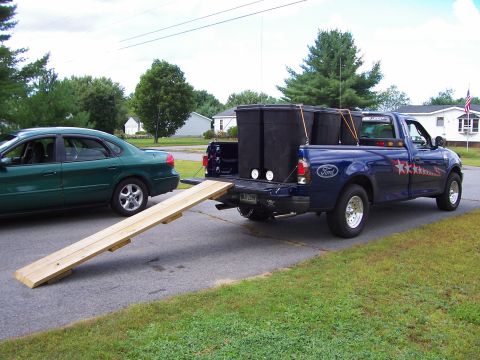 1998 Ford F-150 - Pine needle removal using six 50 gallon Rubermaid containers on wheels.