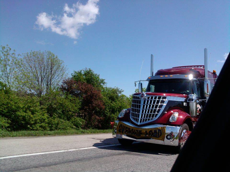International LoneStar truck with "OVERSIZE LOAD" banner on bumper