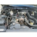 1998 Ford Crown Victoria - Very small, low-resolution photo of a car's engine bay under an open hood, with a V8 engine, black hoses and accessory pulleys visible. The…
