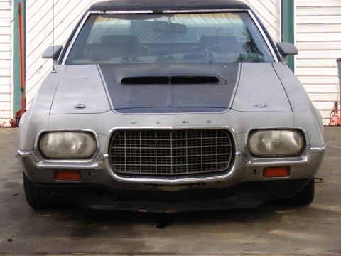 1973 Ford Ranchero - The front grille and headlights of a classic Ford Ranchero are visible in this head-on shot.