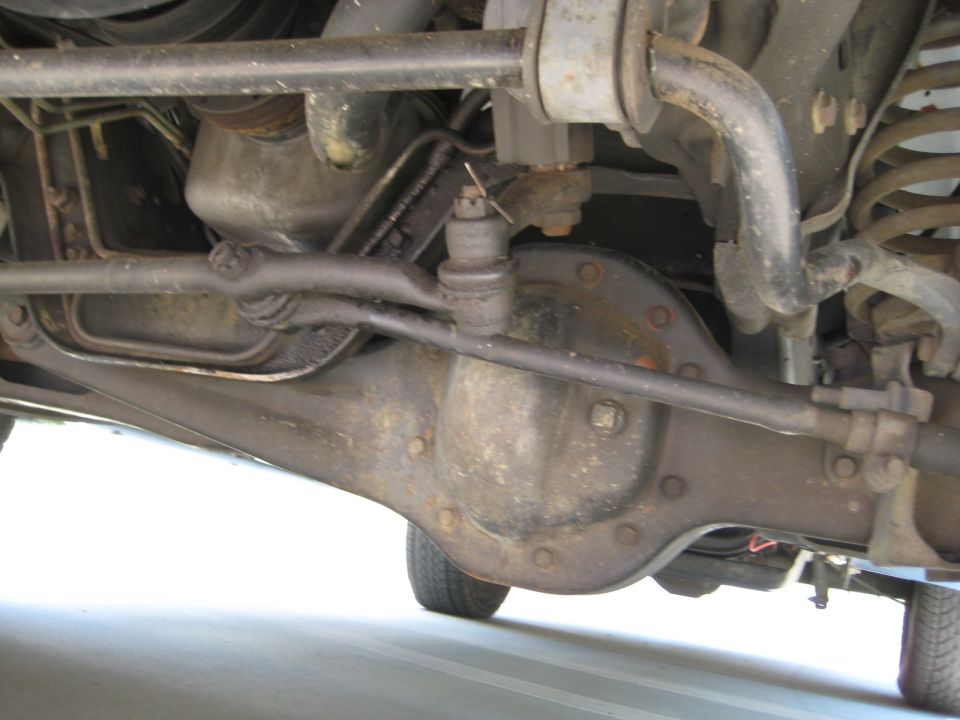 Undercarriage of a 1992 Ford Bronco showing the front differential and suspension components