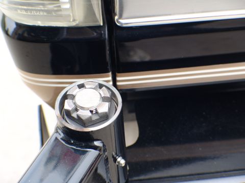 1996 Ford Bronco - Detail of a lug nut on a vehicle's wheel assembly.