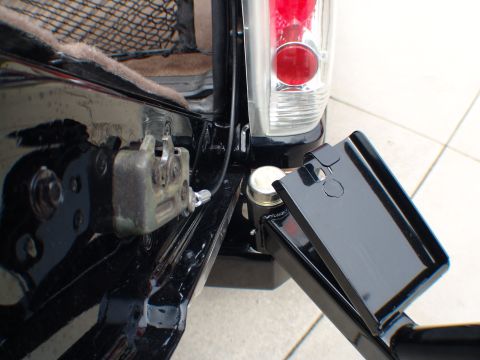 1996 Ford Bronco - Close-up of the rear latch mechanism and trailer hitch assembly on a 1996 Ford Bronco.