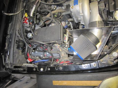 2008 Jeep Wrangler - Aftermarket air intake system installed in the engine bay.