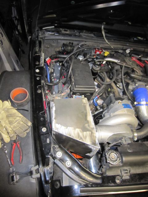 2008 Jeep Wrangler - Custom intake fabrication in a Jeep Wrangler engine bay, showing a supercharger.