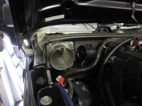 2008 Jeep Wrangler - Custom intake tube installed in the engine bay, obscuring most of the vehicle details.