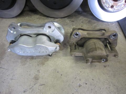 2008 Jeep Wrangler - Comparison of a new Teraflex brake caliper and an old one, with rotors visible.
