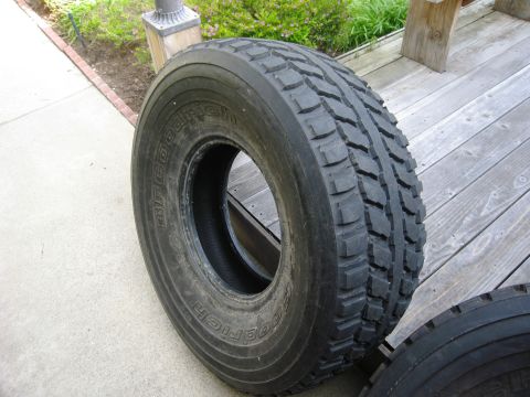1986 Ford Bronco - A close-up view of a BFGoodrich tire, showing its tread pattern and sidewall markings.