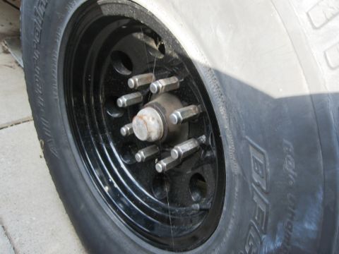 1986 Ford Bronco - Close-up of a BFGoodrich tire mounted on a black steel wheel.