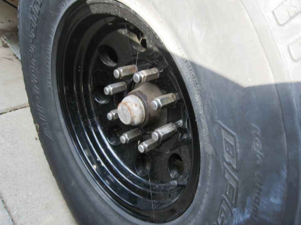 Black steel wheel with lug nuts and BFGoodrich tire
