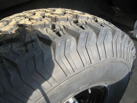 1986 Ford Bronco - A close-up view of a BFG All Terrain tire, size 315/75/16, is shown.