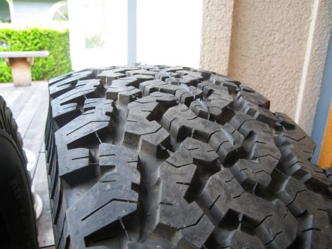 1986 Ford Bronco - Close-up of the aggressive tread pattern on a BFG All Terrains 315/75/16 tire.