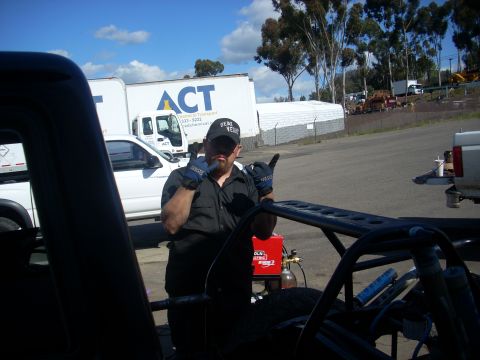 1992 Ford Ranger - Man poses with welding equipment in front of ACT transport trucks.
