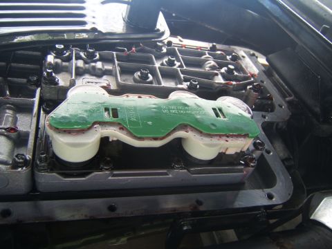 1988 Ford Bronco - Close-up of an automatic transmission valve body, showing the circuit board and solenoids.