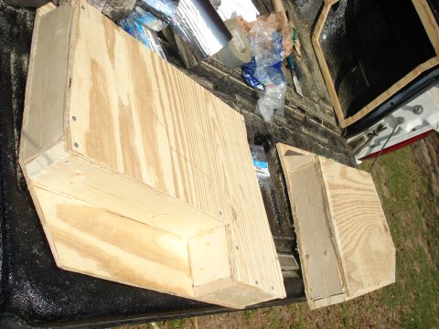 1992 Ford C-350 (Centurion Conversions) - Custom wooden boxes are being constructed or transported in the bed of a pickup truck.