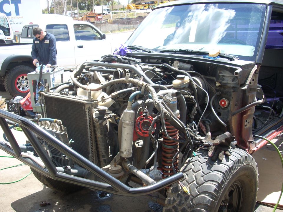 1992 Ford Ranger engine bay showing custom roll cage and modified suspension