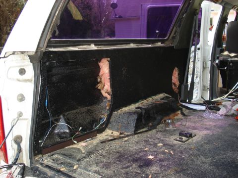 1992 Ford C-350 (Centurion Conversions) - Interior of a white pickup truck undergoing modifications, showing exposed insulation and wiring.
