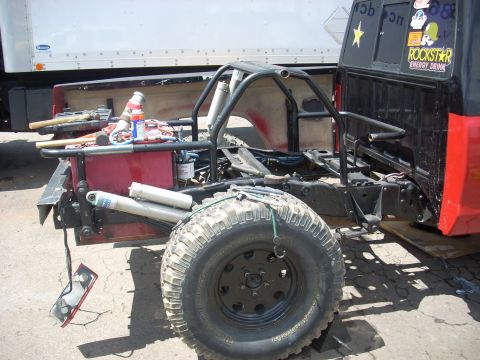 1992 Ford Ranger - A custom-built truck chassis is shown with its suspension and roll cage exposed, ready for off-road modification.