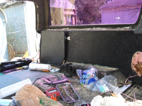 1992 Ford C-350 (Centurion Conversions) - Vehicle interior undergoing work, with tools and debris scattered around.