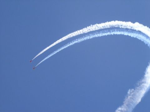 1979 Ford Bronco - Airplanes create smoke trails while performing aerobatics in the sky.