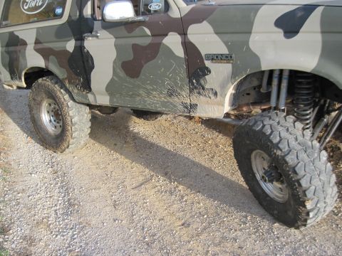 1995 Ford Bronco - This Ford Bronco features a camouflage paint job and is equipped for off-road use.