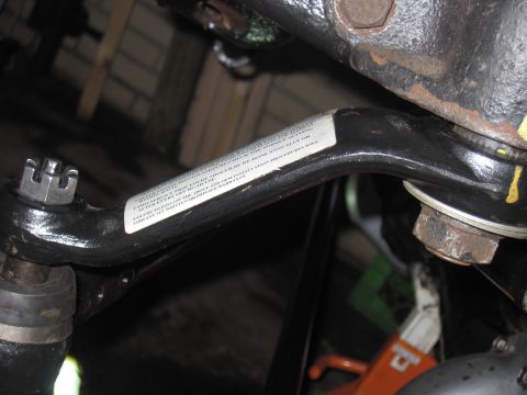 1979 Ford Bronco - Close-up of a vehicle's steering linkage, a critical suspension component.