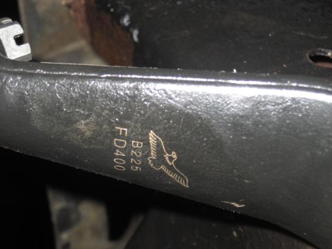 1979 Ford Bronco - Close-up of a metal part showing etched identification numbers and a bird emblem.