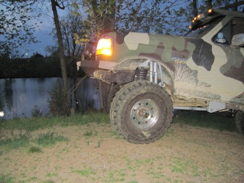 1995 Ford Bronco - This 1995 Ford Bronco features a camouflage paint scheme and an aftermarket lifted suspension.
