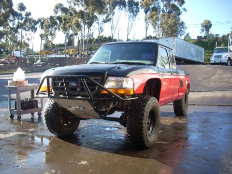 1992 Ford Ranger - This modified 1992 Ford Ranger features a lifted suspension, aggressive off-road tires, and a custom front bumper.