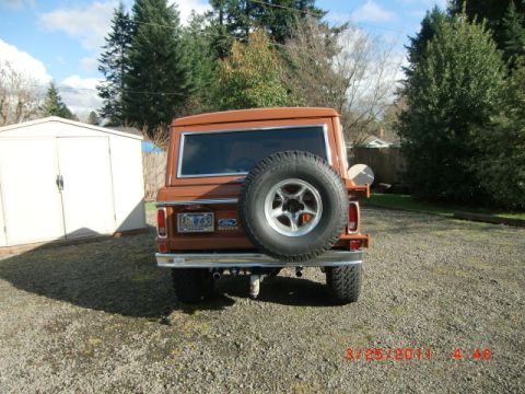 1973 Ford Bronco - This 1973 Ford Bronco is parked in a gravel driveway next to a white shed.