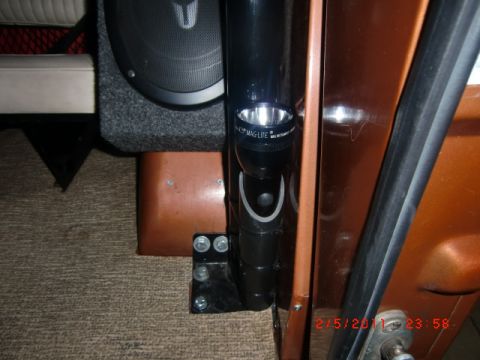 1973 Ford Bronco - Vehicle interior detail with speaker and flashlight mount visible.
