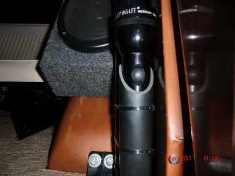 1973 Ford Bronco - Maglite flashlight and speaker box visible inside a vehicle's interior.