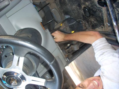 1992 Ford Ranger - Wiring being worked on inside a vehicle's cabin, near the steering wheel.