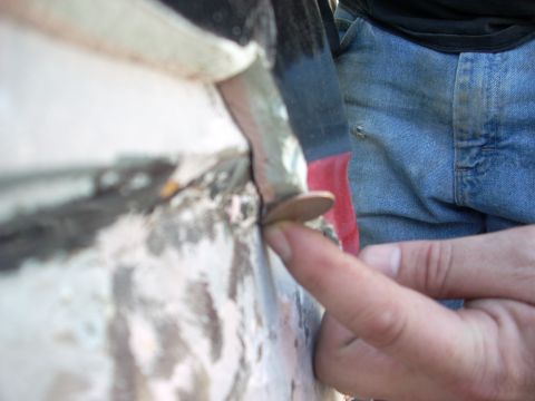 1992 Ford Ranger - A penny is used to demonstrate the size of a gap on a vehicle's body panel, suggesting a potential fitment issue or modification.