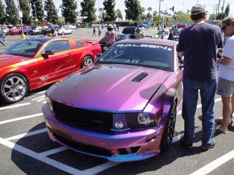 1993 Ford Taurus - A custom Ford Mustang Saleen is displayed at an outdoor event.