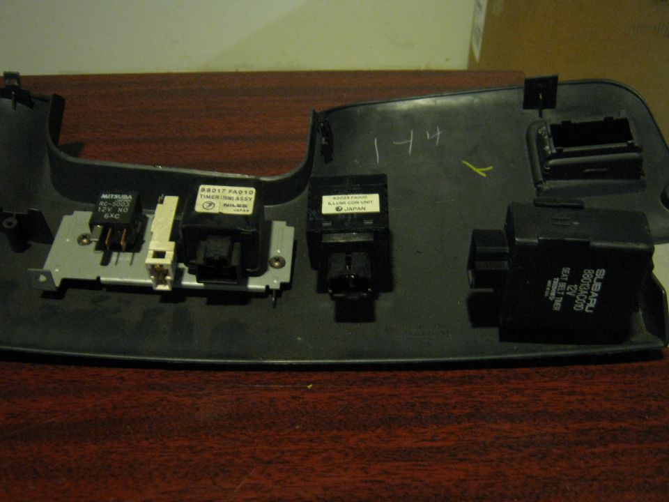 Under dash shroud thing with electrical things on it. Will separate.