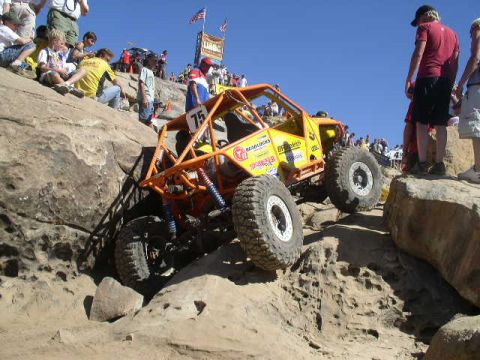 1979 Ford Bronco - A custom-built off-road buggy navigates a rocky terrain during a competition.