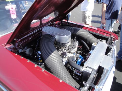 1993 Ford Taurus - Close-up of a modified engine bay with custom air intake and cooling system.