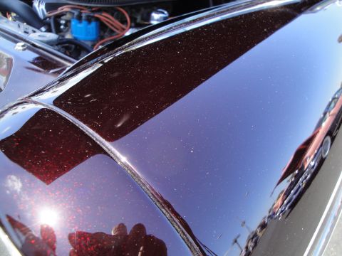 1993 Ford Taurus - Engine bay detail and metallic flake paint on a car fender.