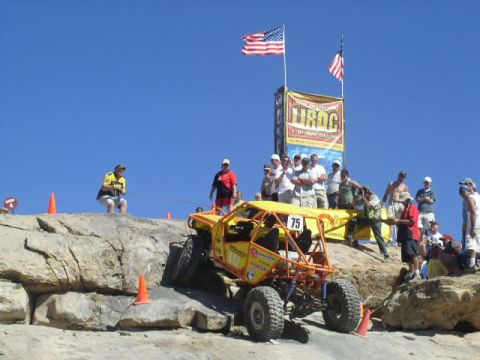 1979 Ford Bronco - An off-road buggy navigates a challenging rocky course during an event.