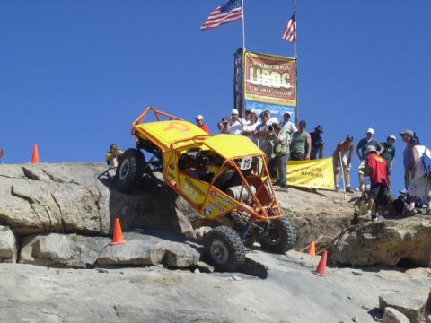 1979 Ford Bronco - An off-road buggy navigates a challenging rocky course during an event.