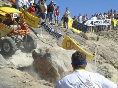 1979 Ford Bronco - An off-road buggy navigates a challenging rocky terrain during a competition.
