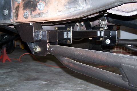 2000 Ford F-150 - Close-up view of custom suspension components and frame modifications.