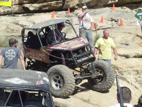 1979 Ford Bronco - A custom-built off-road buggy is the focus of this scene, with spectators nearby.