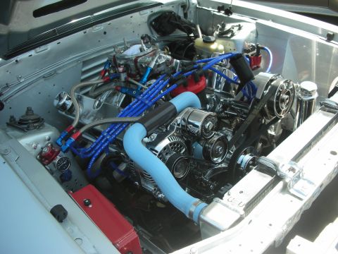 2004 Ford Crown Victoria - Customized V8 engine bay polished components and vibrant blue wiring.