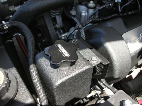 2004 Ford Crown Victoria - Close-up of an engine bay a black Moroso cap on a reservoir.