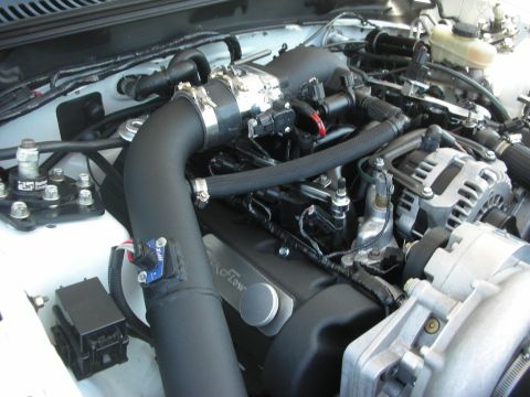 2004 Ford Crown Victoria - Close-up of a Ford engine bay, an aftermarket K&N intake and Flowmaster valve cover.