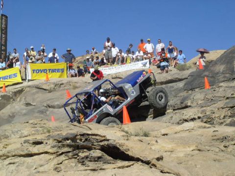 1979 Ford Bronco - An off-road buggy navigates a challenging rocky terrain during a competition.