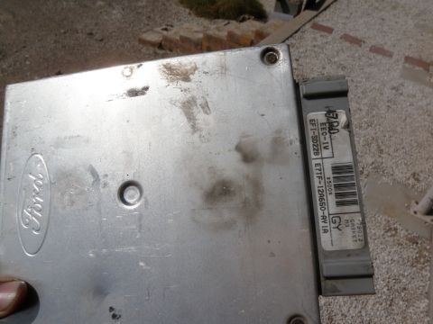 1982 Ford Bronco - A close-up of a Ford EEC-IV engine control module, showing its part number and Ford branding.