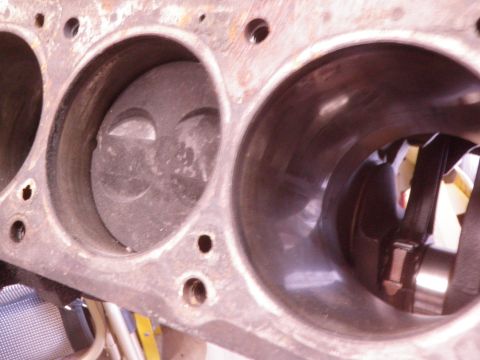 1982 Ford Bronco - Close-up view of an engine block showing two pistons within their cylinders.